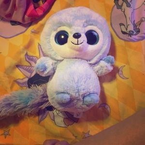 Plush very cute purple and blue and a black nose